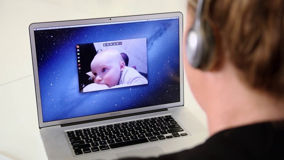 image of child breastfeeding on a laptop