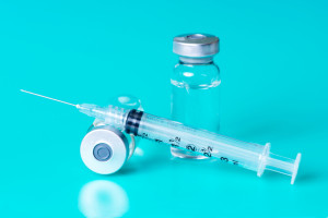 Syringe and vials of injectable medication.