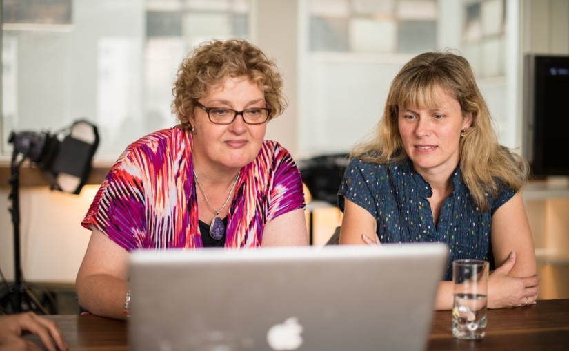 women looking at a laptop