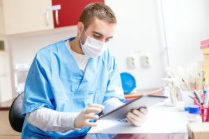 research scientist looking at the tablet, using technology for b