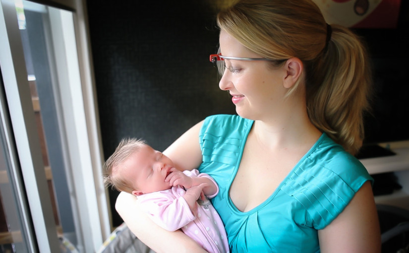 breastfeeding mum smiling at her daughter